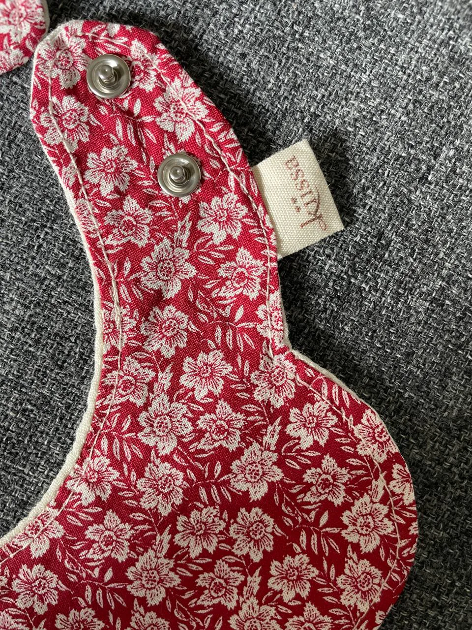 Vintage Red — a flower-shaped bib in vintage red floral cotton